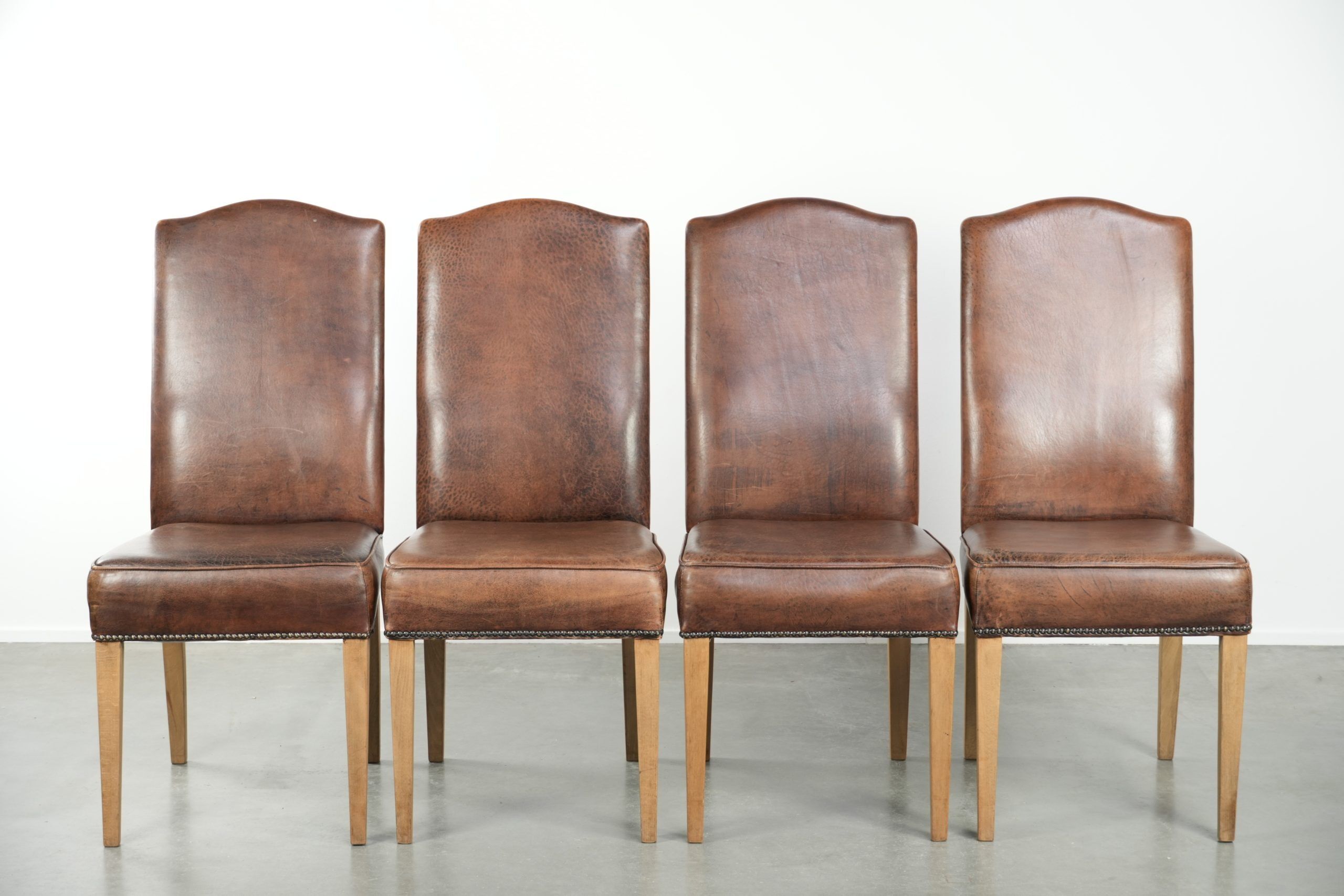 Vintage set of 4 dining chairs made of sheepskin leather with a high back