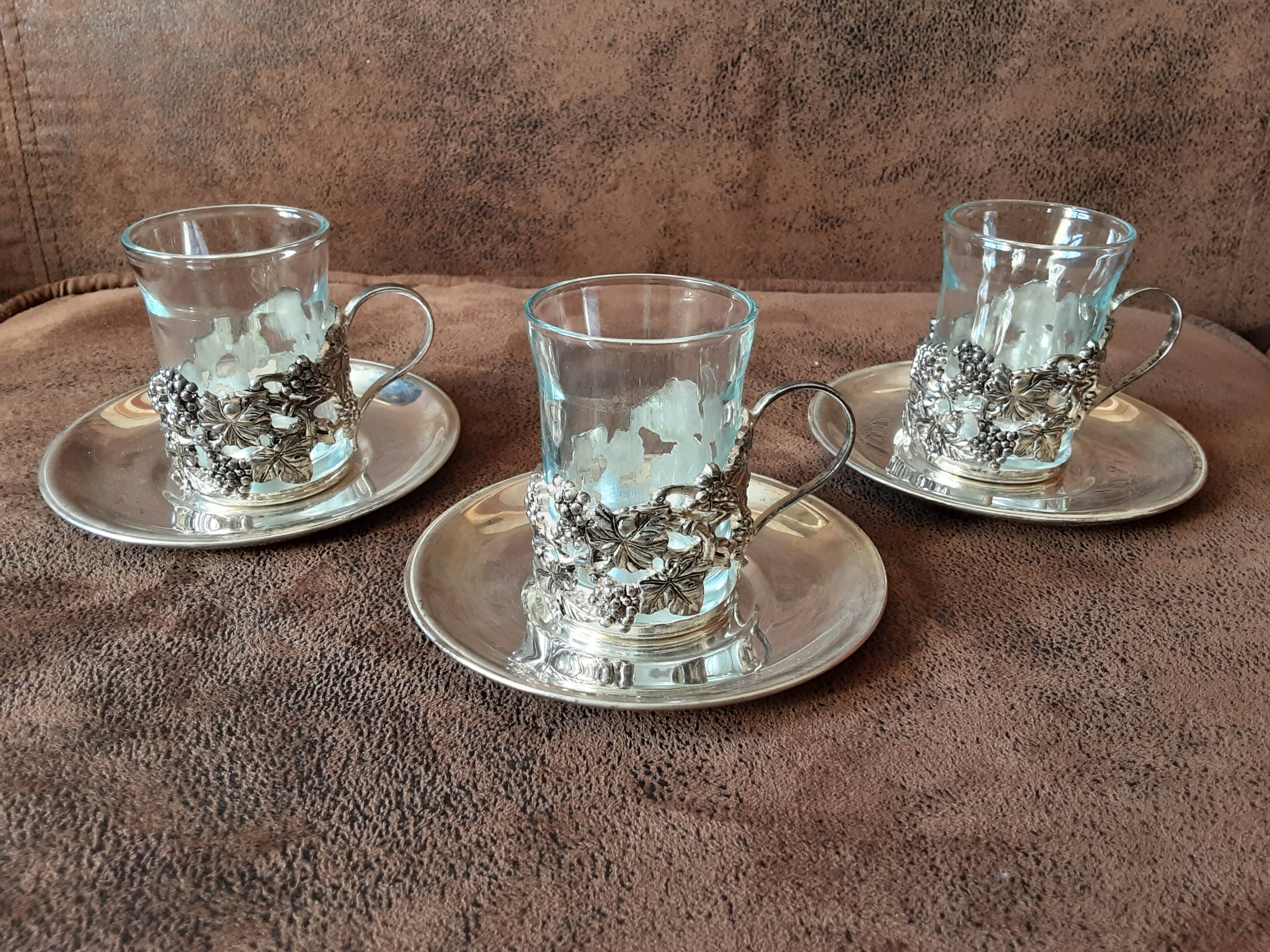 Set of 3 small metal glasses and saucers