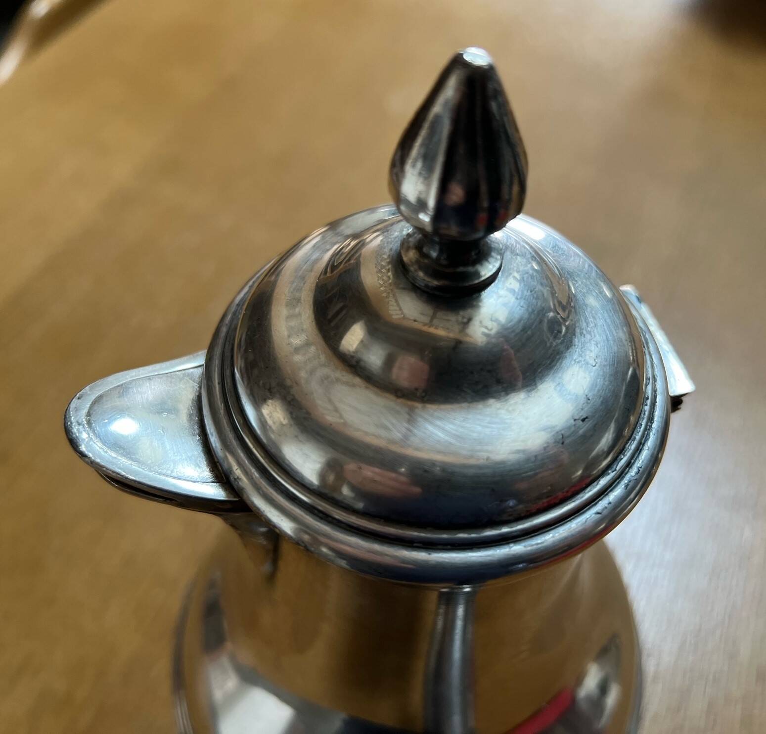Silver-plated metal chocolate pot stamped ARGIT SFOA with an ebony handle.