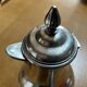 Silver-plated metal chocolate pot stamped ARGIT SFOA with an ebony handle.