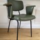 Vintage chair with green imitation leather armrests