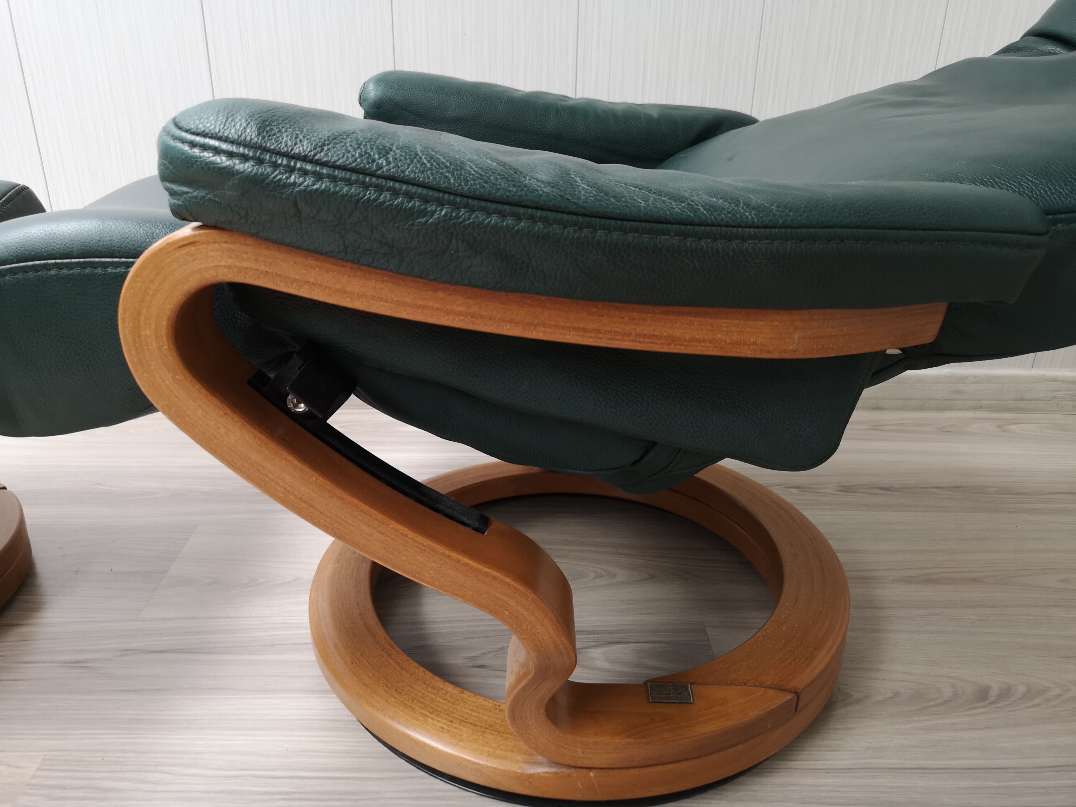 Mid - century leather armchair with footrest with relax function from himolla