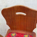 2 curved wood and red fabric chairs