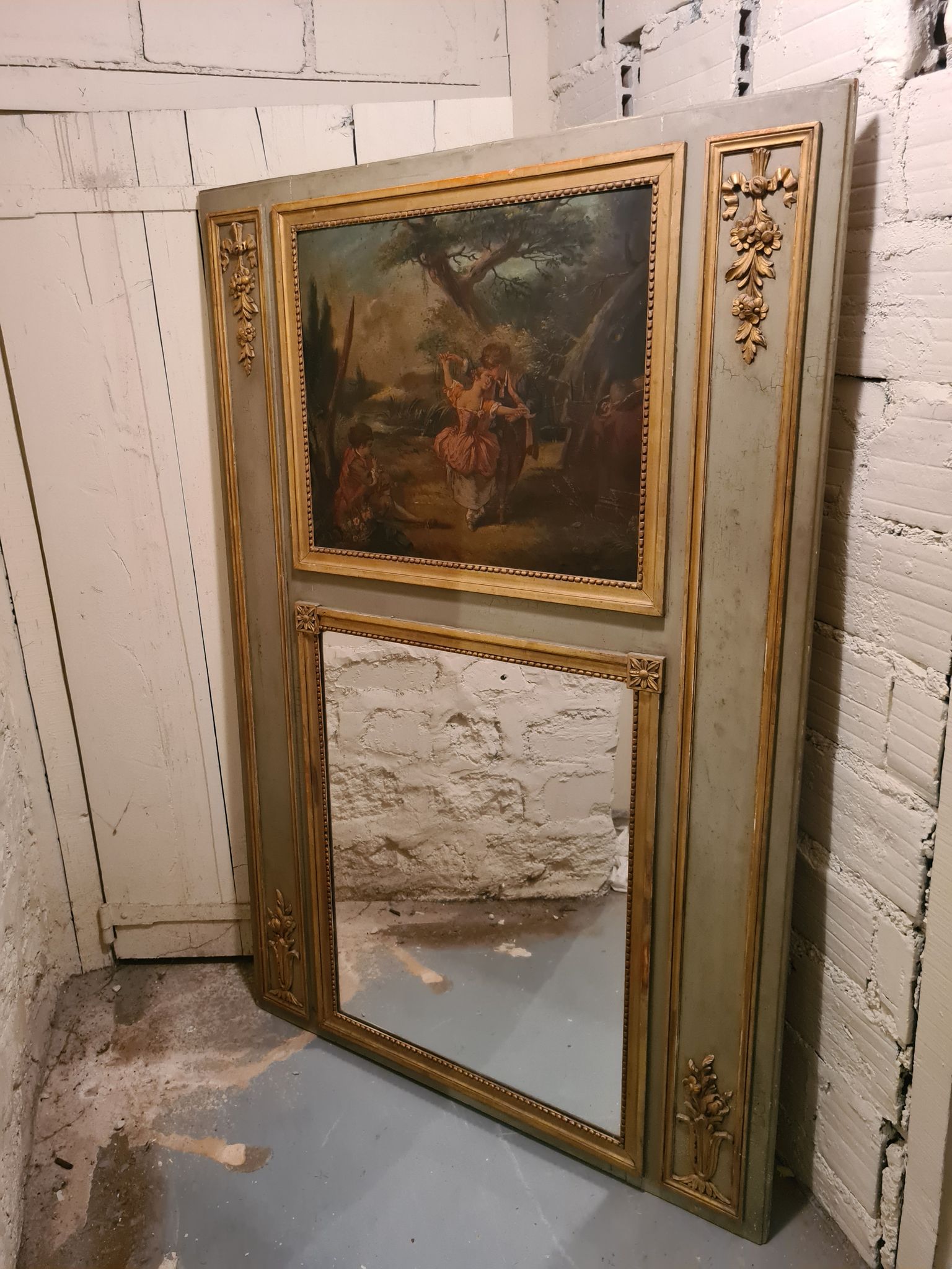 Lacquered wooden trumeau in the Louis XVI style, late 19th century.