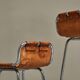 Set of 2 stools "Les Arcs" selected by Charlotte Perriand in leather.