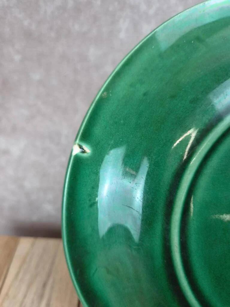 Set of 2 green earthenware dessert plates with vine decoration.