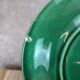 Set of 2 green earthenware dessert plates with vine decoration.
