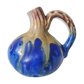 Vintage decanter in enamelled earthenware