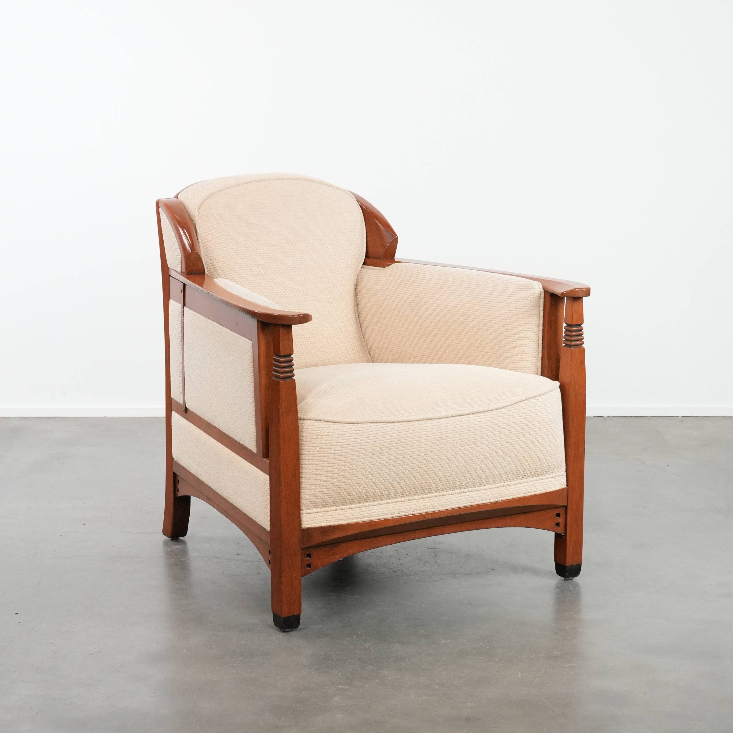 Art Nouveau design armchair with a luxurious light fabric upholstery