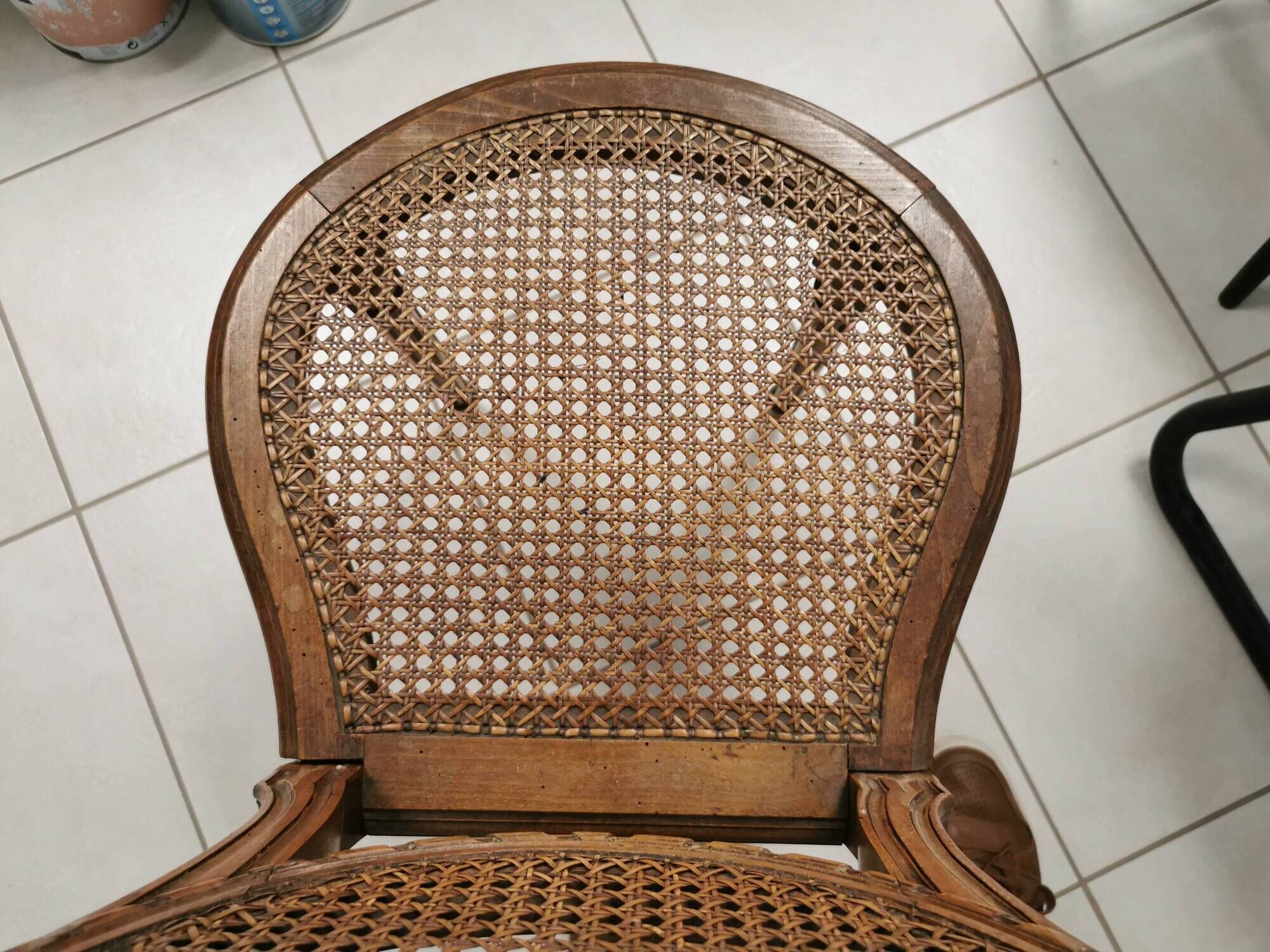 Antique chair Louis XVI style, seat caned, carved wood