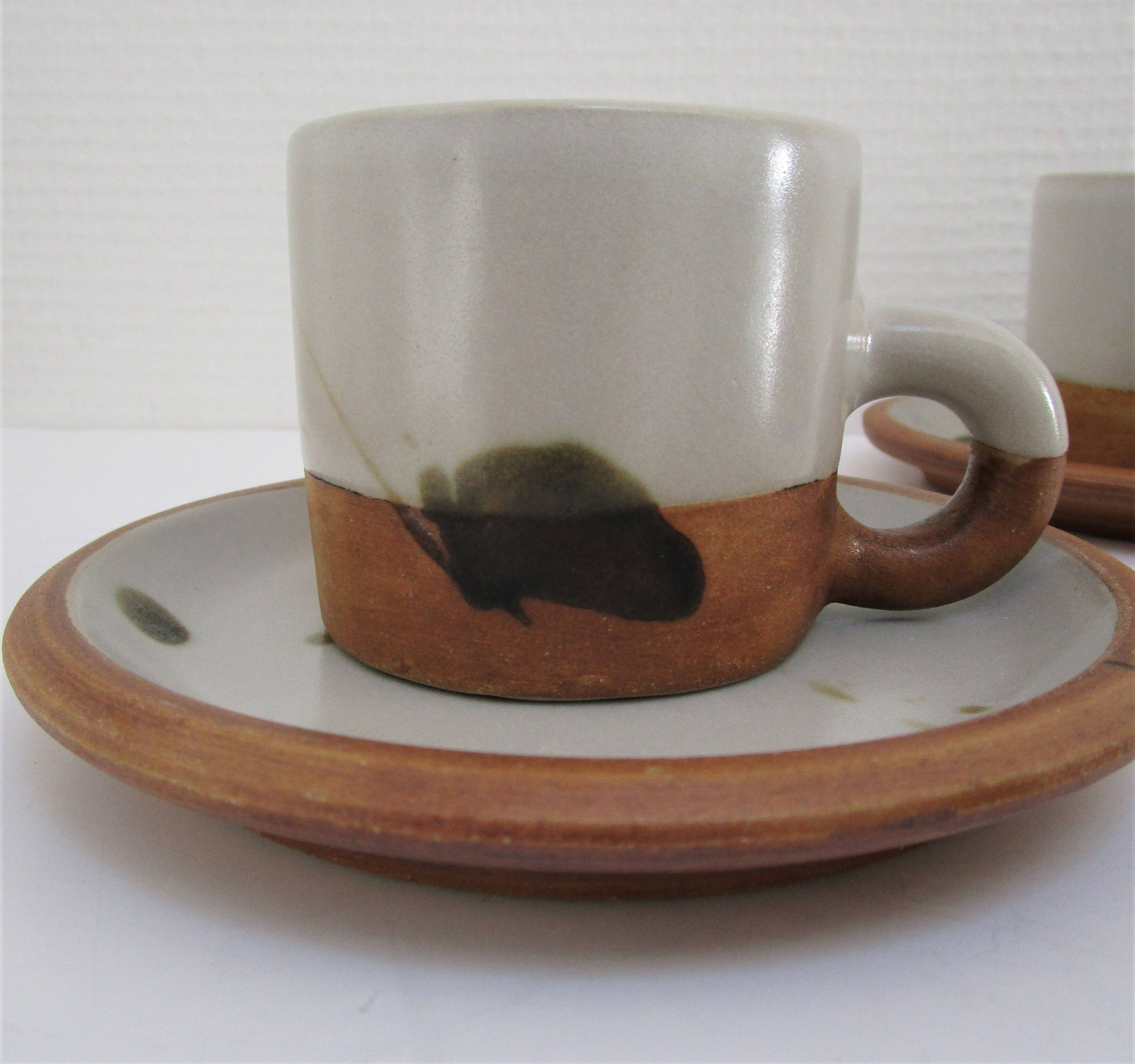 Four pottery cups and saucers from La Colombe Vallauris