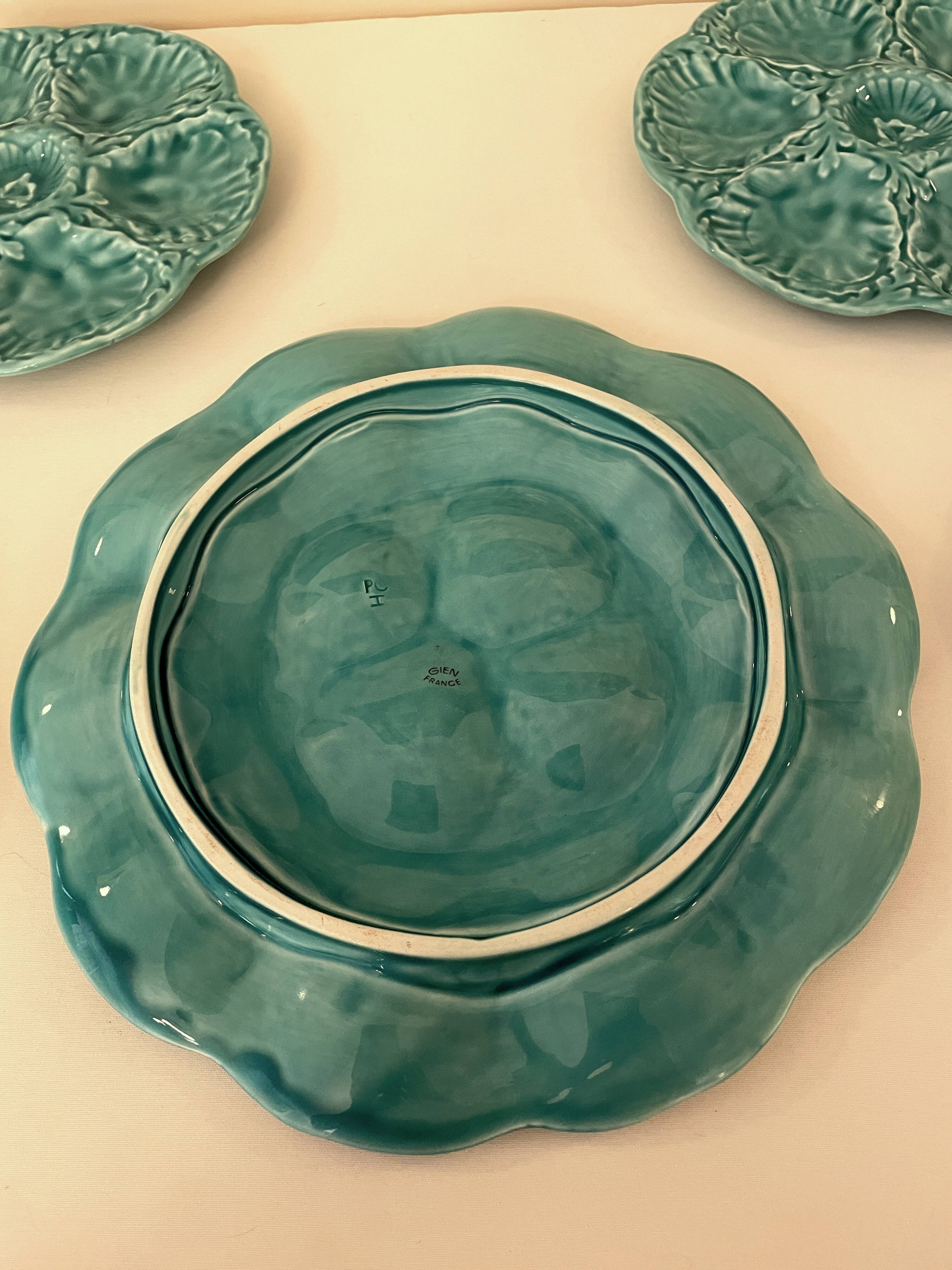 Dish and 4 turquoise faience oyster plates from Gien, France.