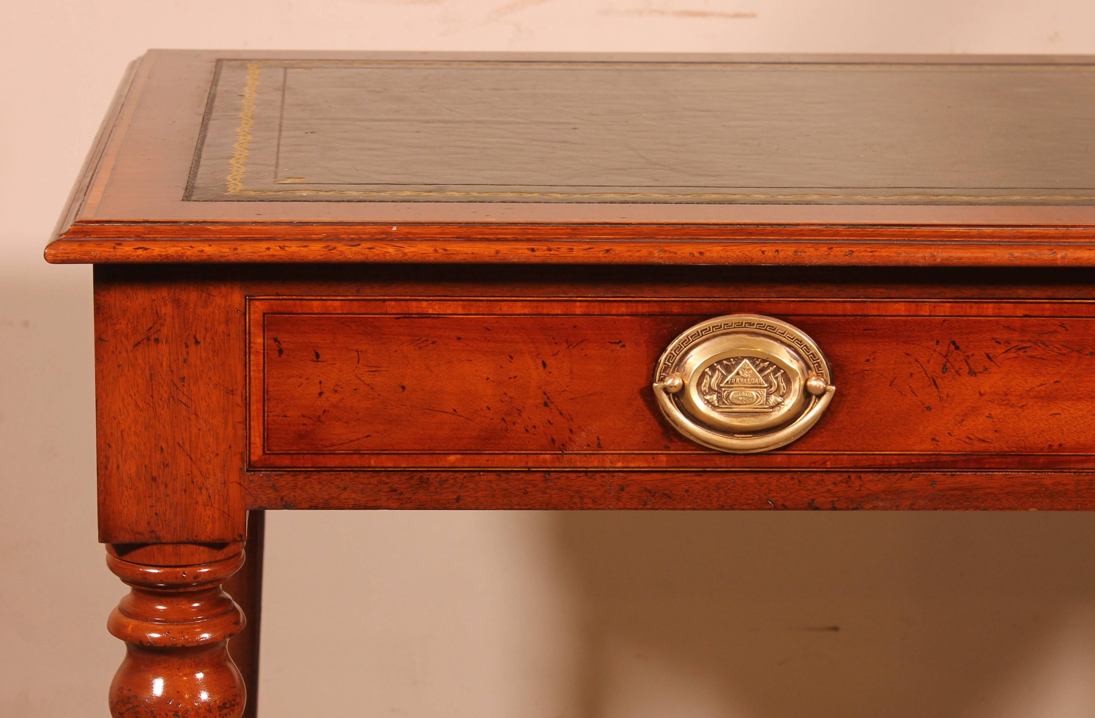 flat desk with two drawers from the 19th century in mahogany and inlays