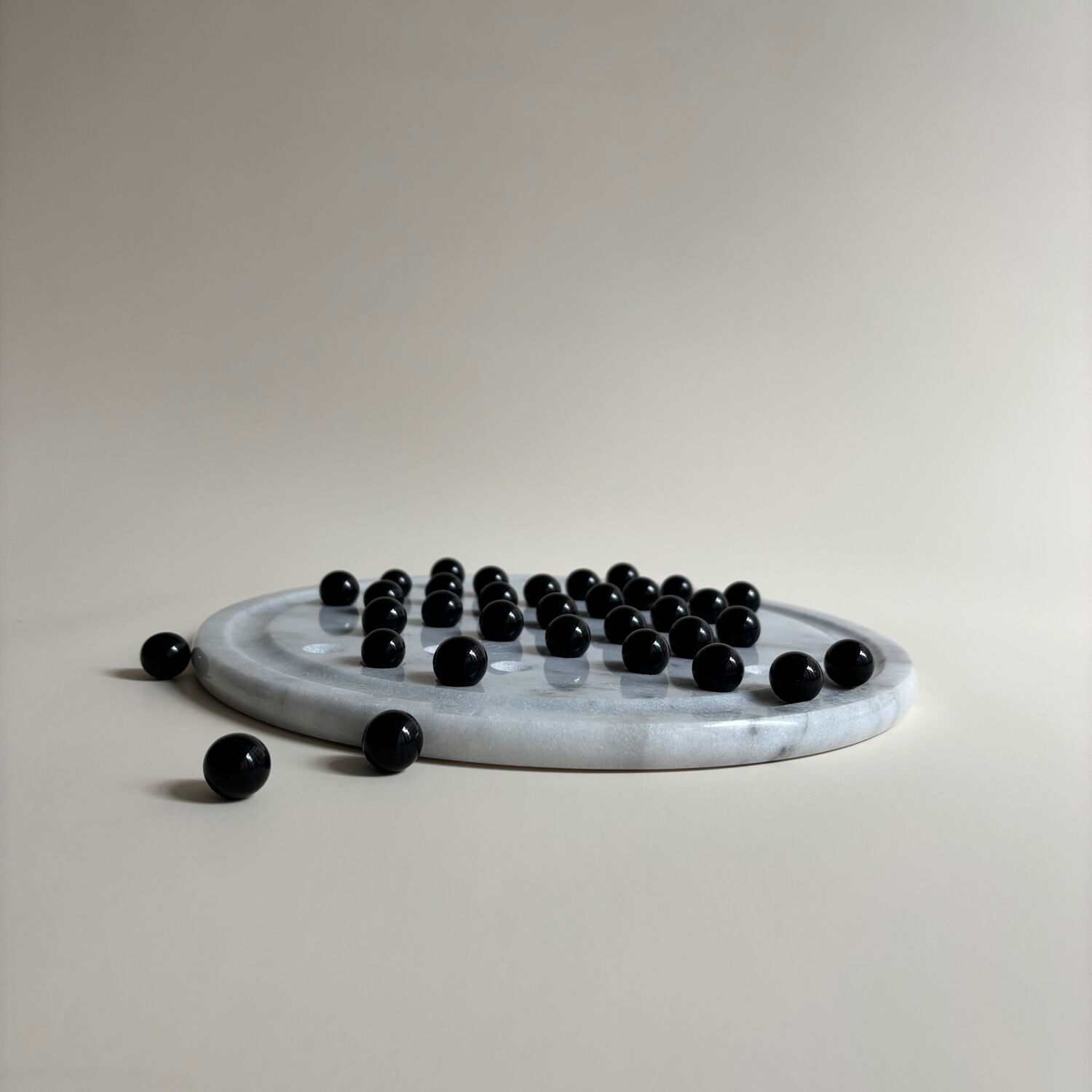 Marble and stone tic-tac-toe games