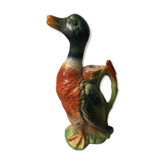Old bottle pitcher in bubble with garnier liquor, duck model