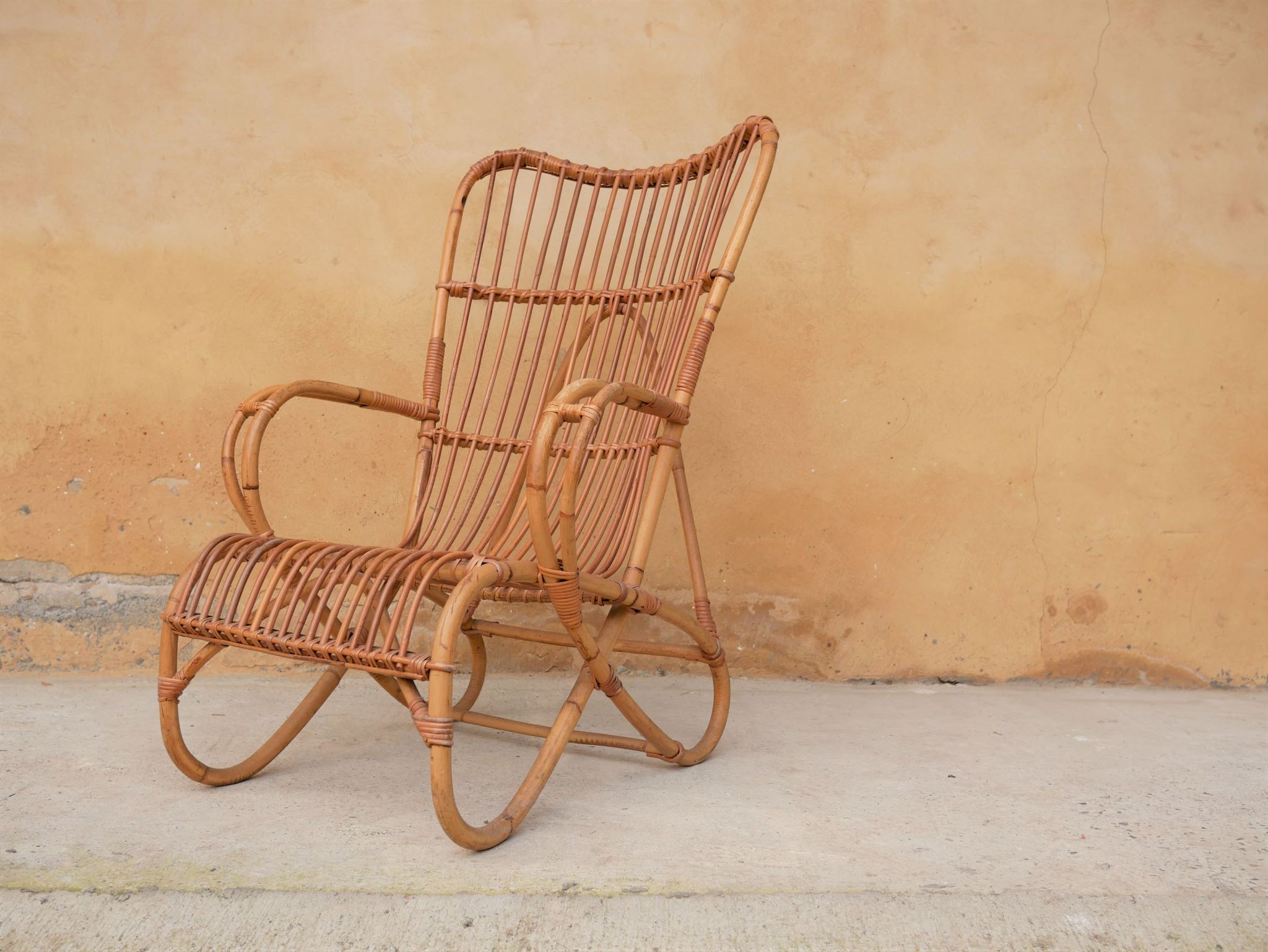 Vintage rattan chair by Louis Sognot