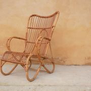 Vintage rattan chair by Louis Sognot