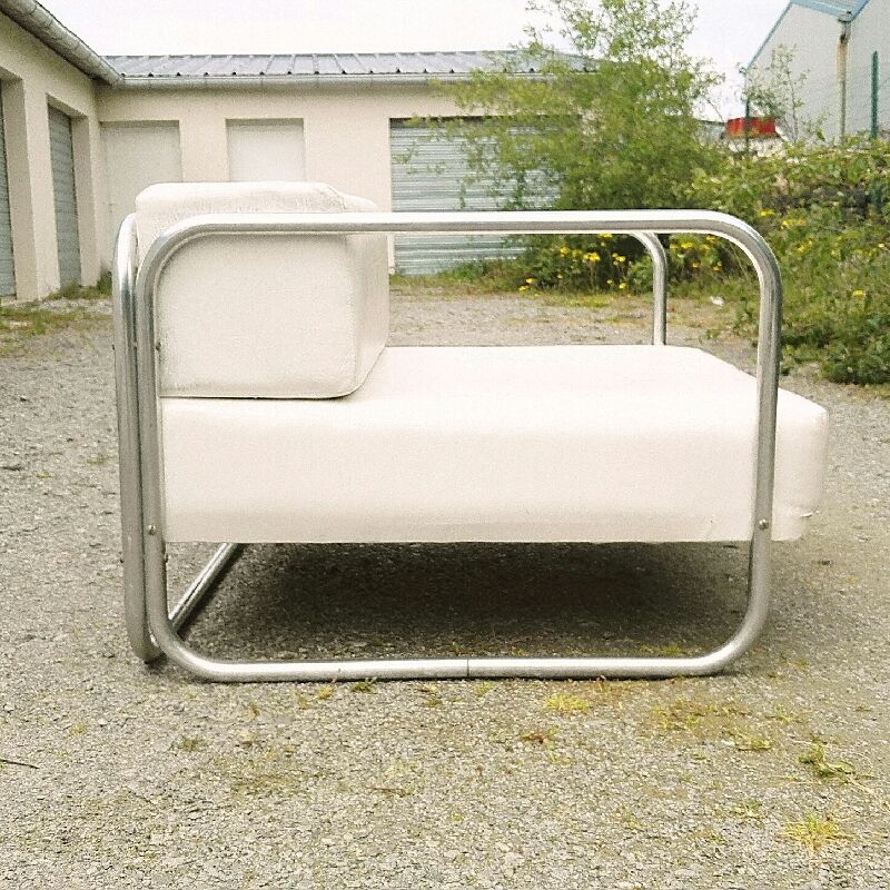 Chrome-designed chair and faux white leather 1970