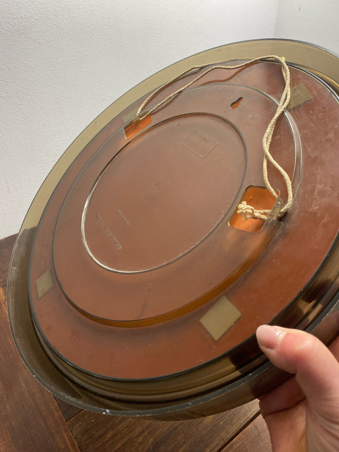Circular mirror, smoked plastic, 1960s/70s.