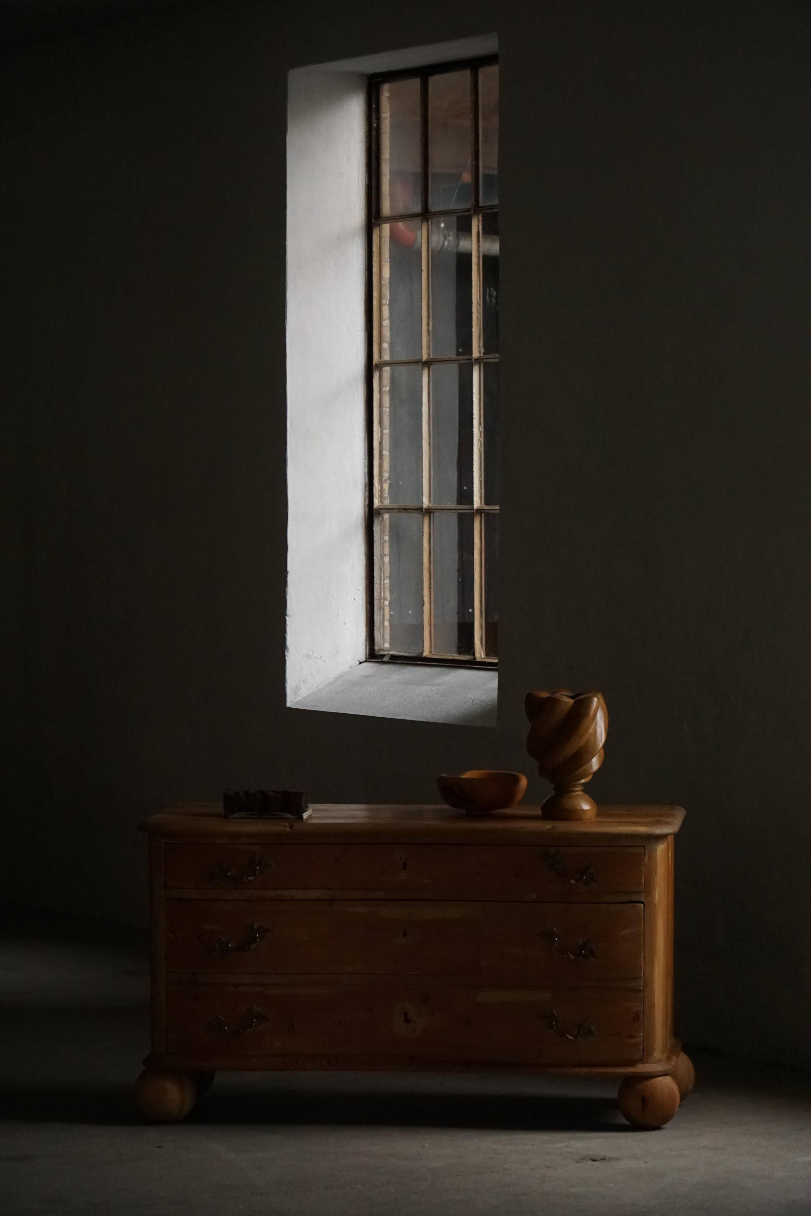 Antique Danish pine commode with ball feet, late 19th century.