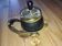 Original vintage ashtray on a small wheeled stand.