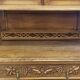 Art Nouveau buffet in carved oak with grapevine cluster decoration.