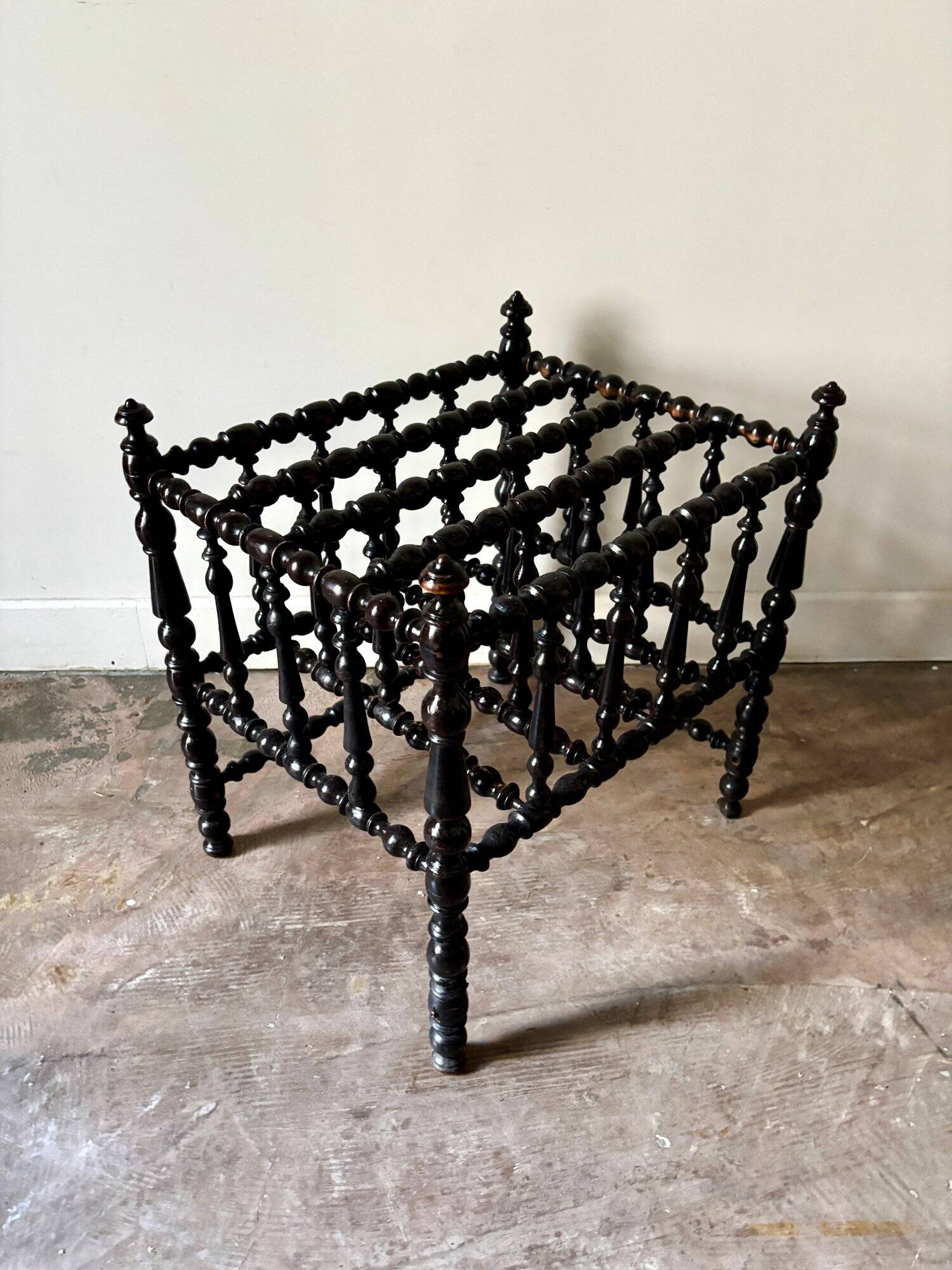 Napoleon III magazine rack in black turned wood