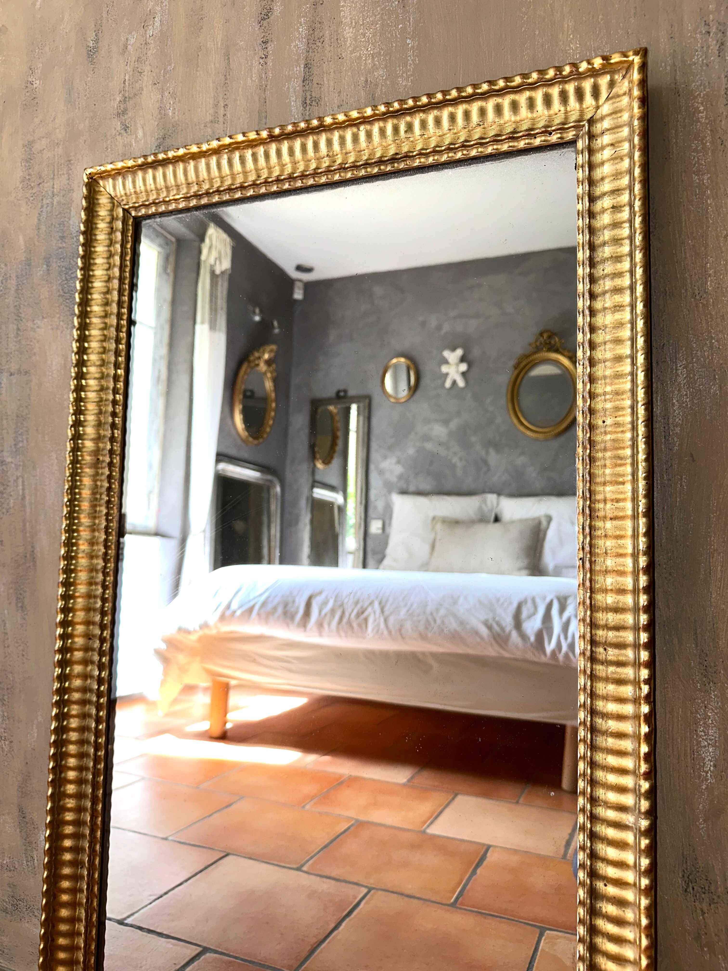 Antique Napoleon III gilded mirror from the 19th century.