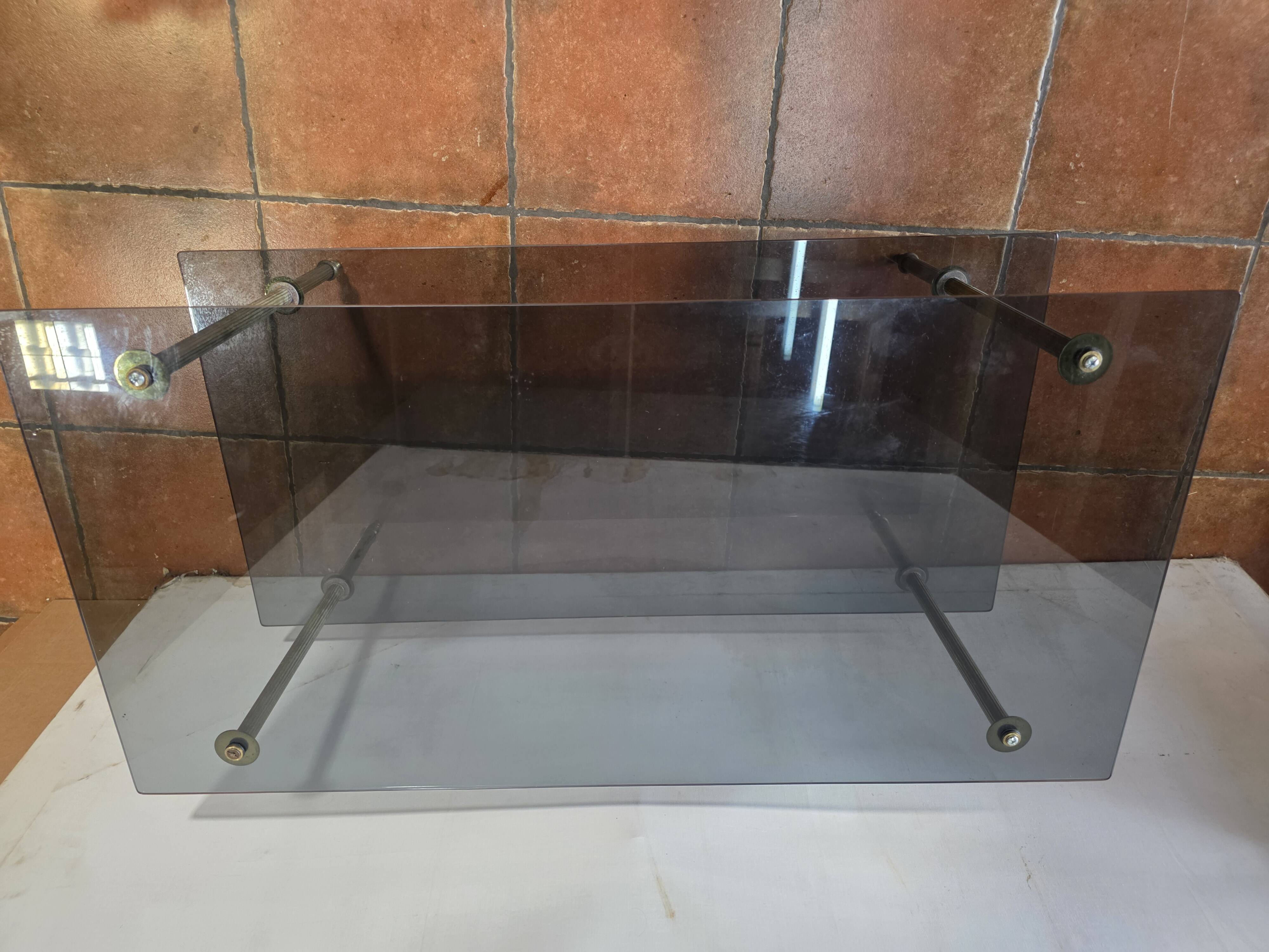 Smoked glass and brass coffee table from the 1970s.