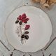 7 mismatched antique dessert plates accompanied by a pie dish