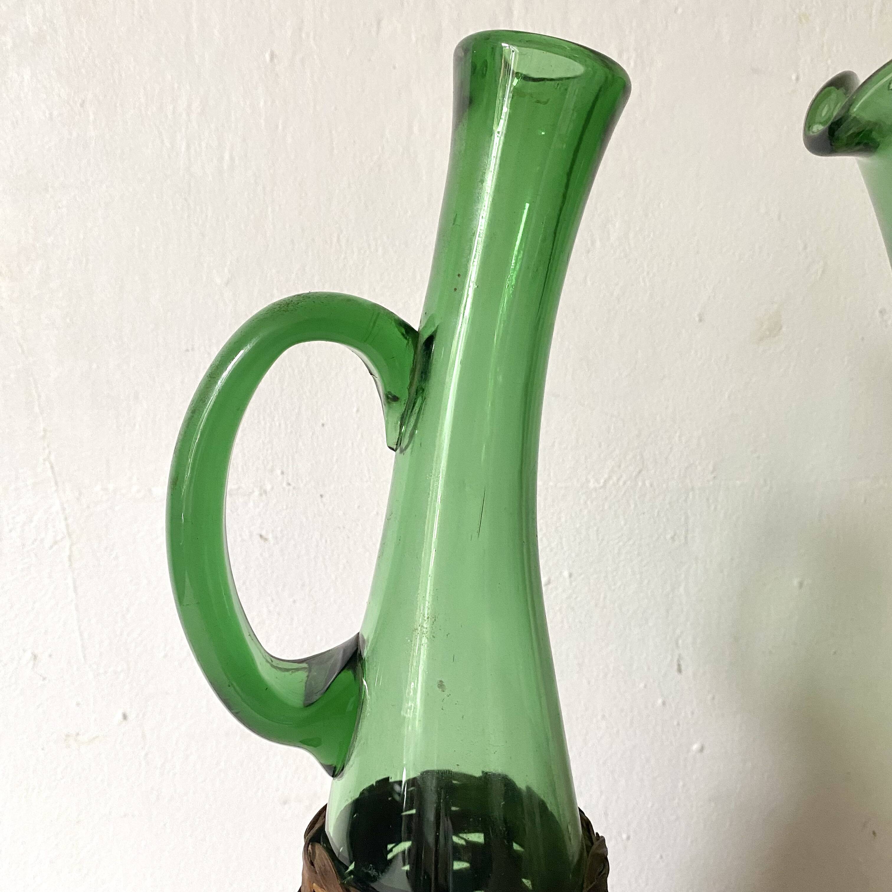 Pitcher and bottle in tinted glass and rattan, Italy, 1960s/1970s