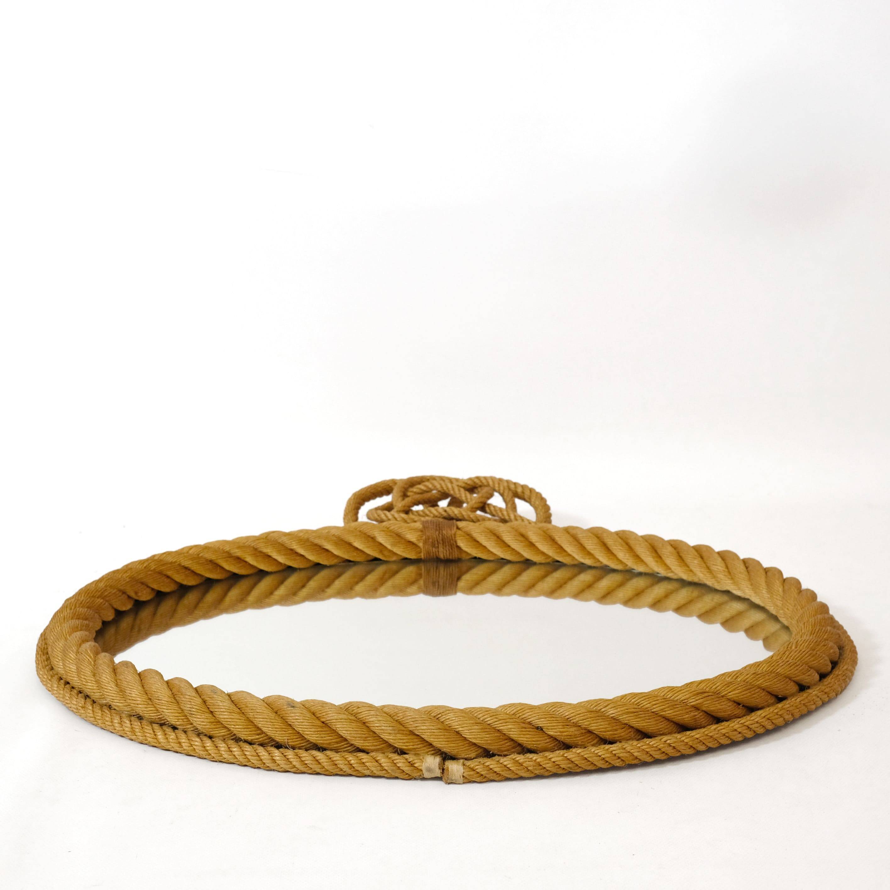 Large oval mirror in rope with pediment, 64cm x 56.5cm.
