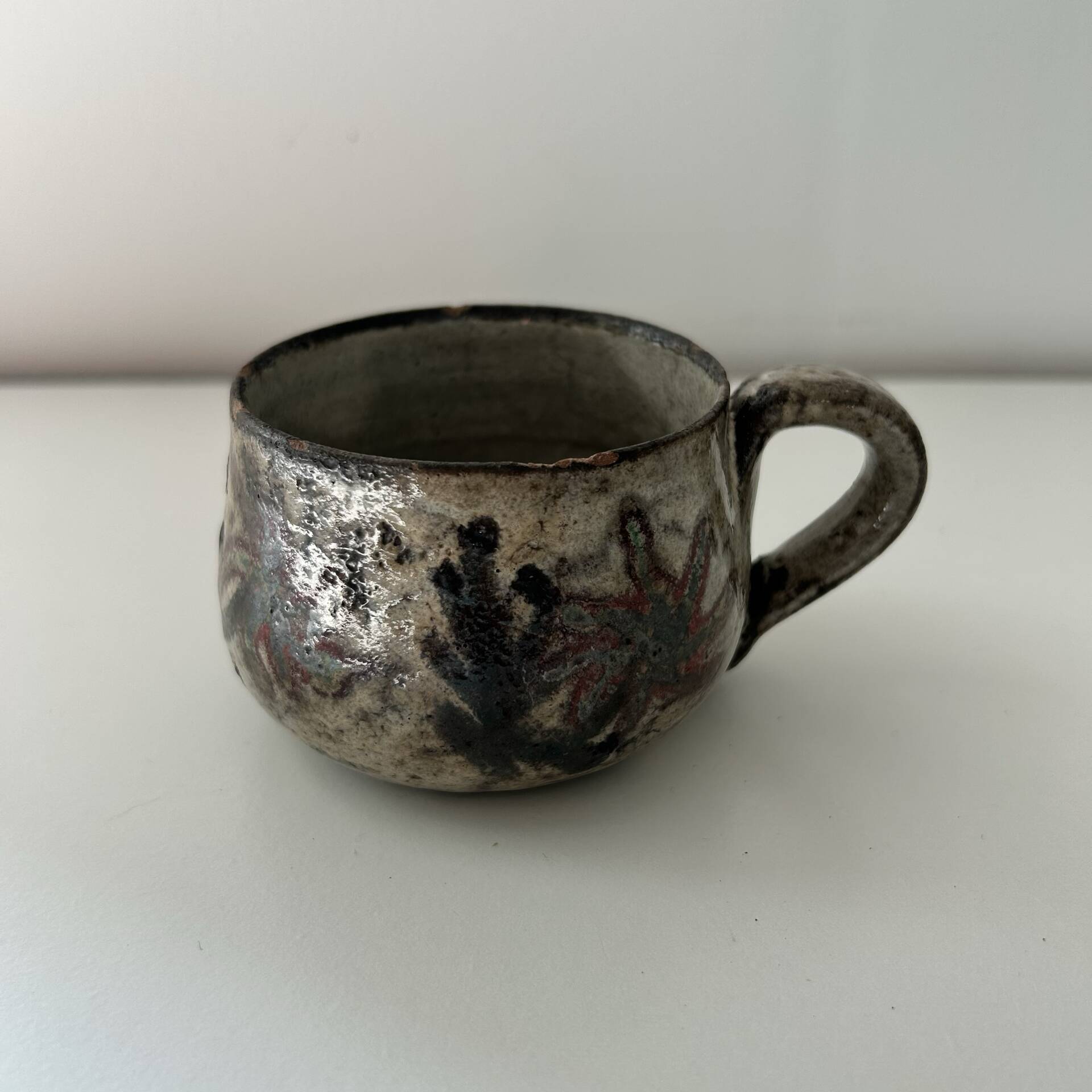 Handcrafted mug with floral decoration