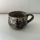Handcrafted mug with floral decoration