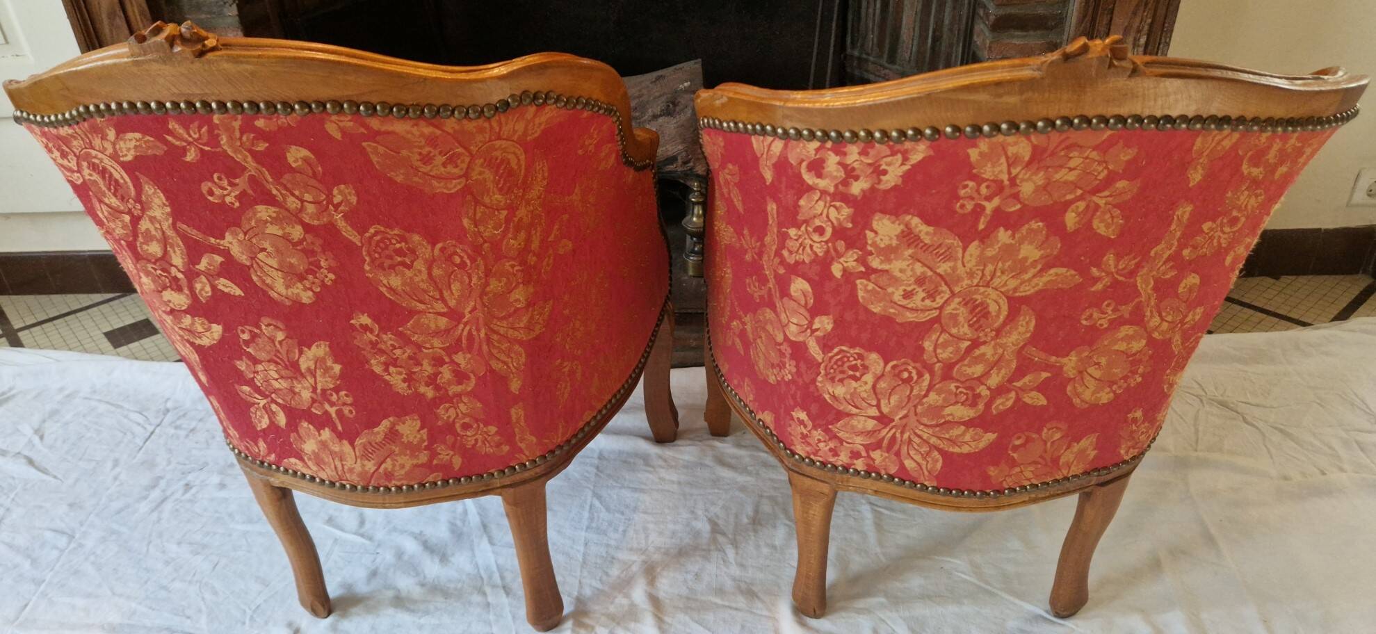 Pair of louis xv cabriolet armchairs with sculpted wood and pink & red floral fabric
