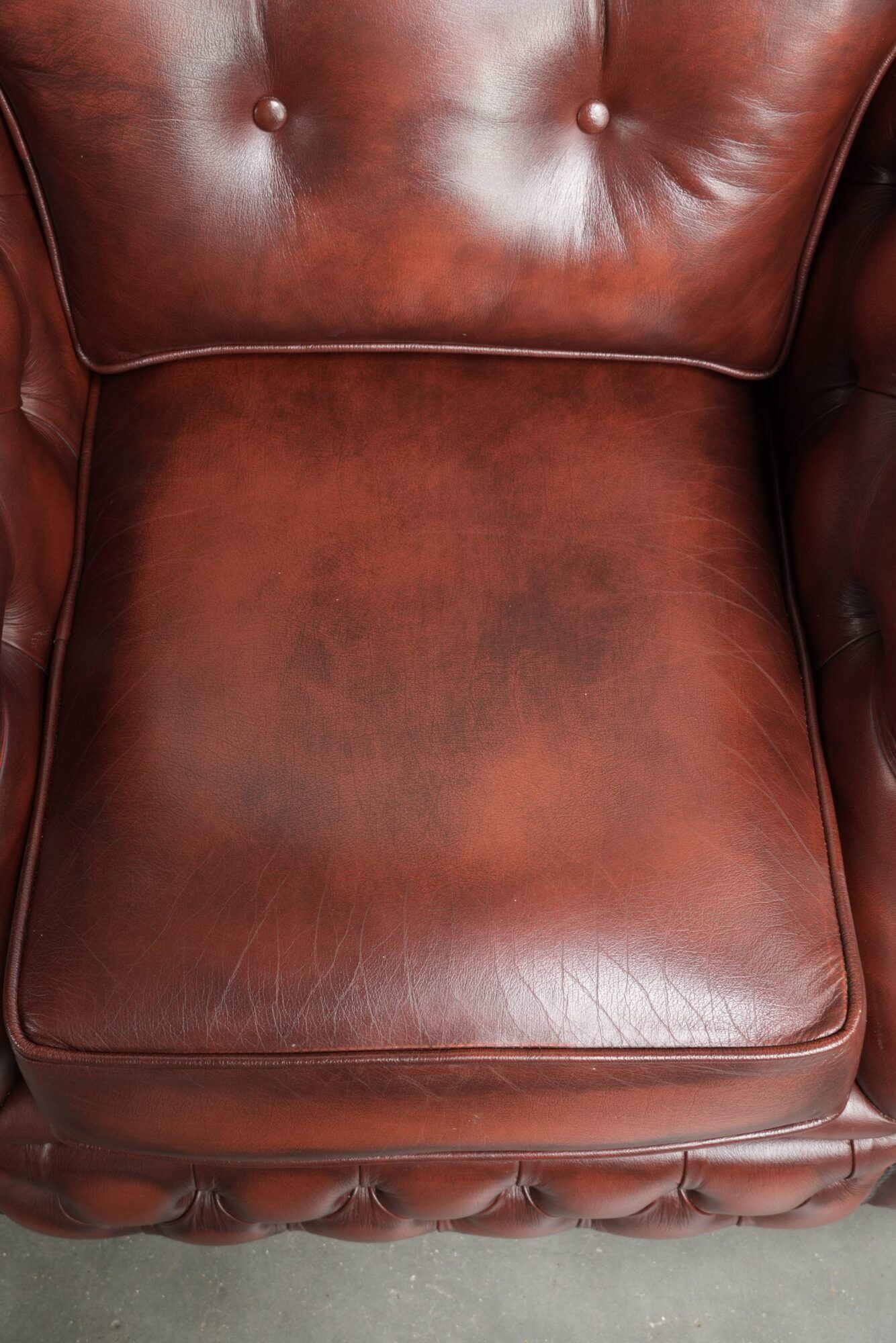 Vintage set of 2 cowhide leather Chesterfield armchairs in a brown colour