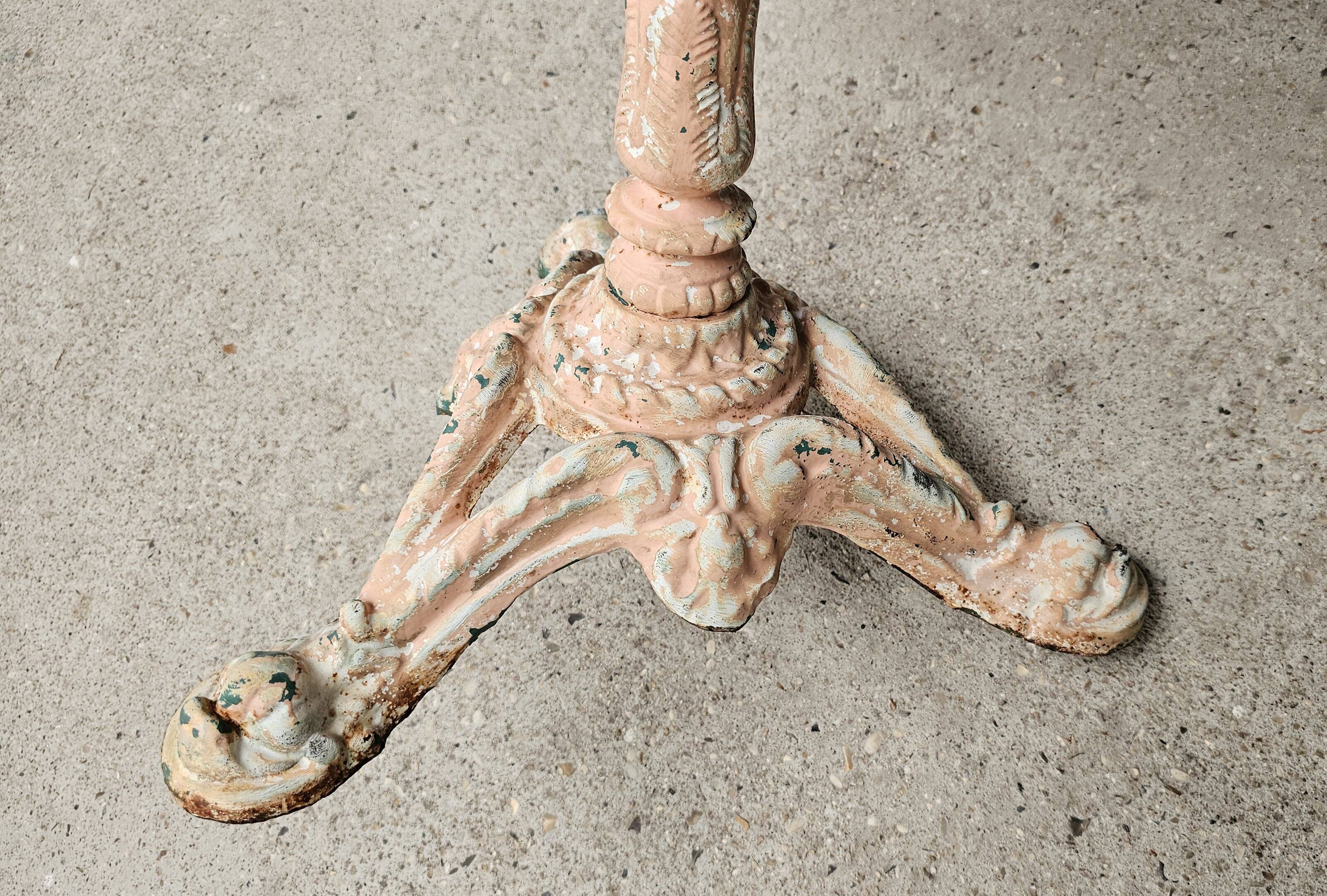 Bistro table with cast iron base and solid teak top