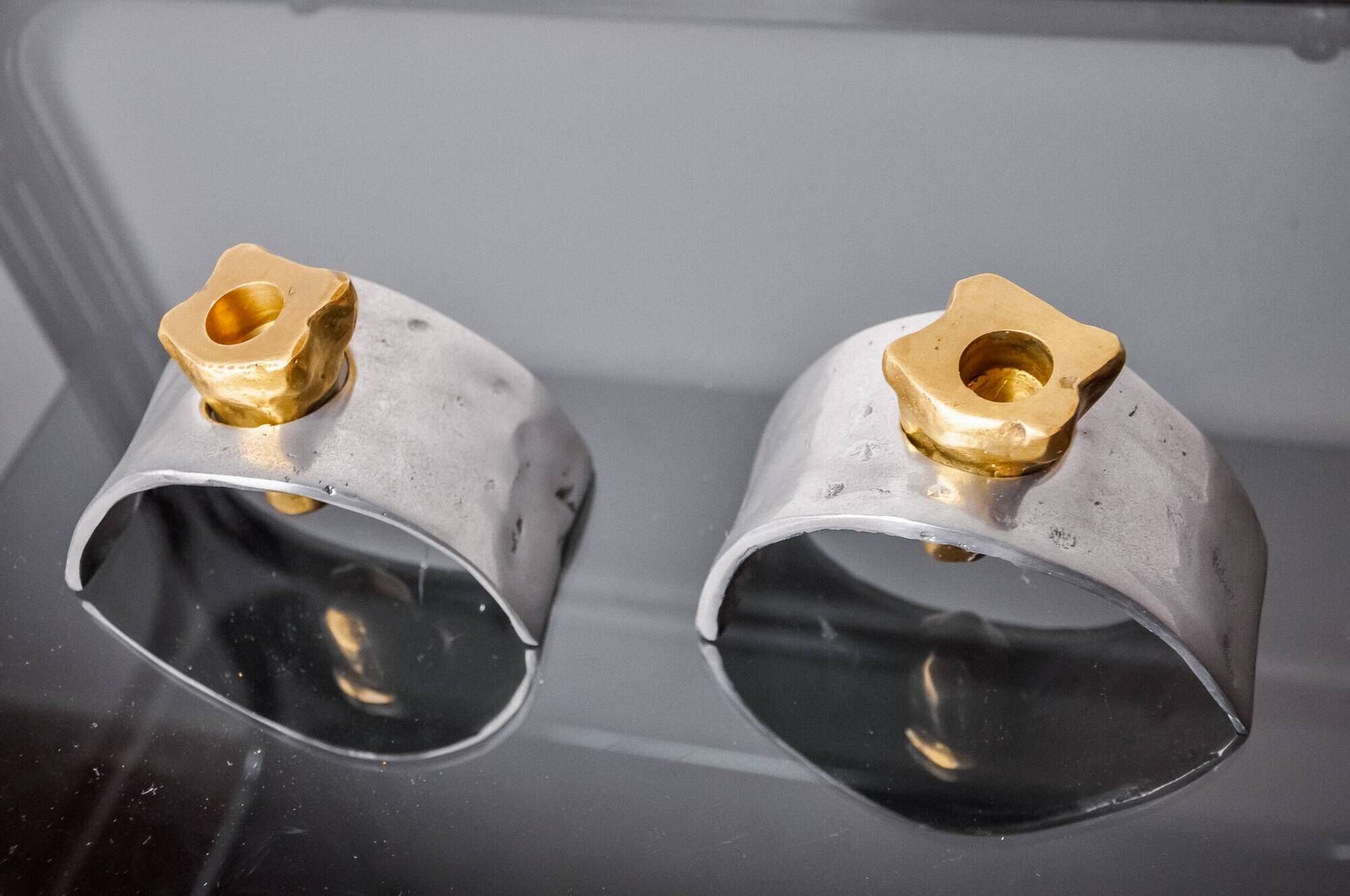 Pair of Brutalist candlesticks by David Marshall, bronze and aluminum, Spain, 1970