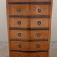 Louis XVI style chest of drawers in wood and cherry veneer.