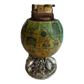 Vintage antique lighter with a globe and silver-plated stand.