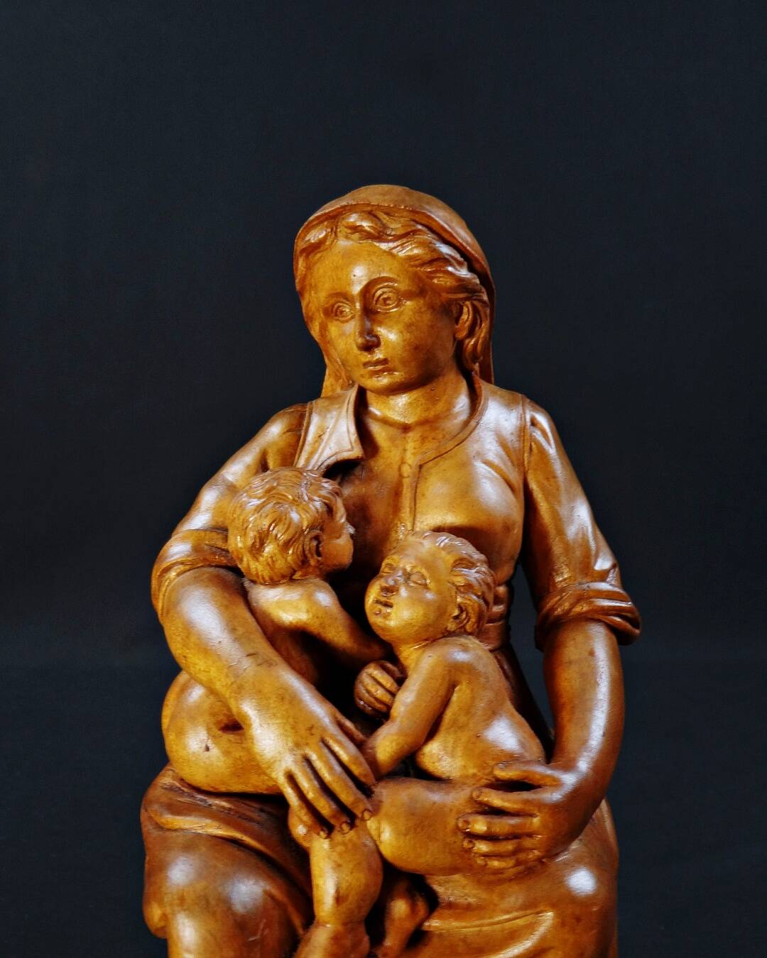 Virgin breastfeeding the Child Jesus and Saint John religious sculpture wood
