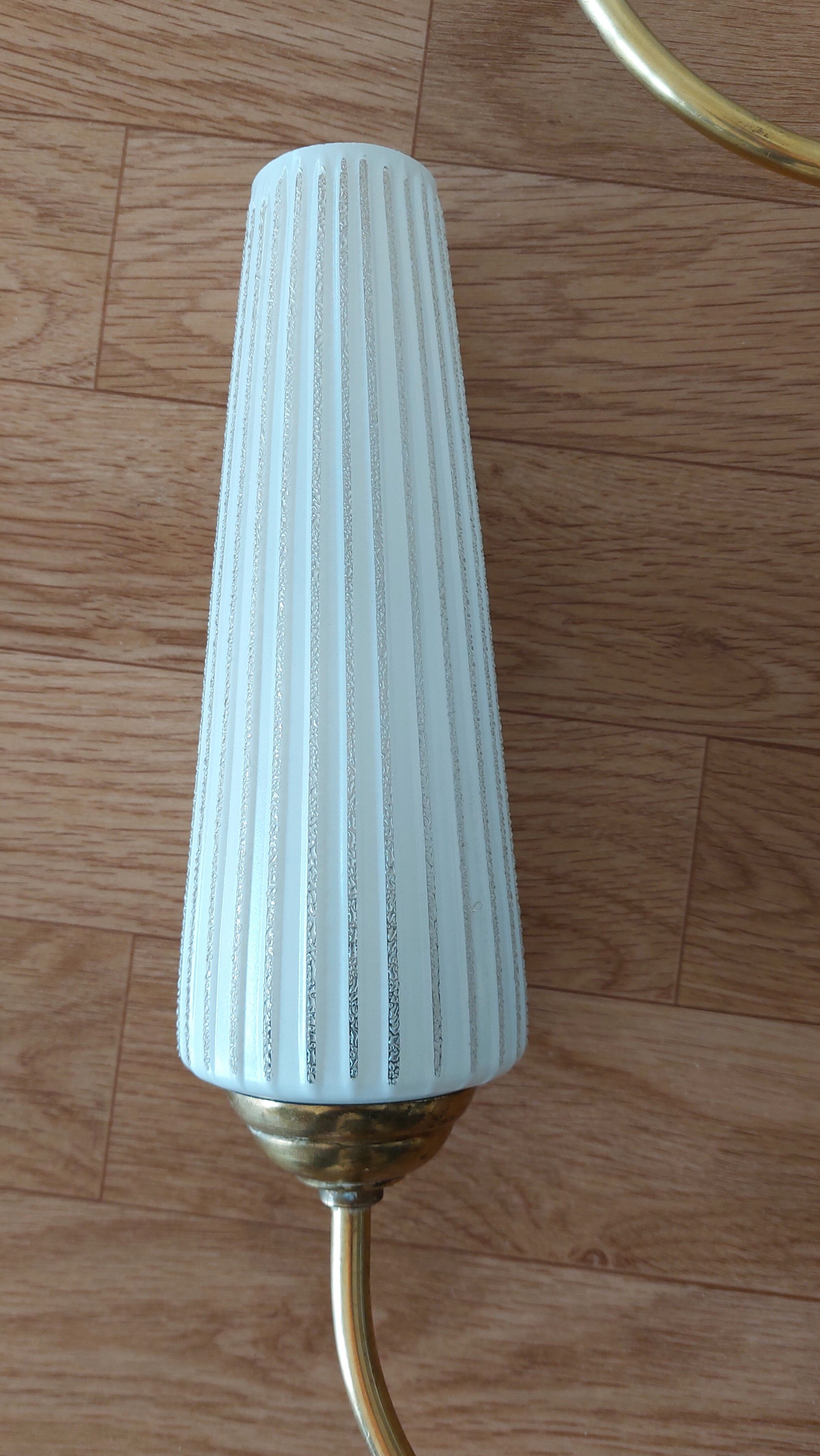 Pair of 1960 wall lamps in gilded brass and glass.