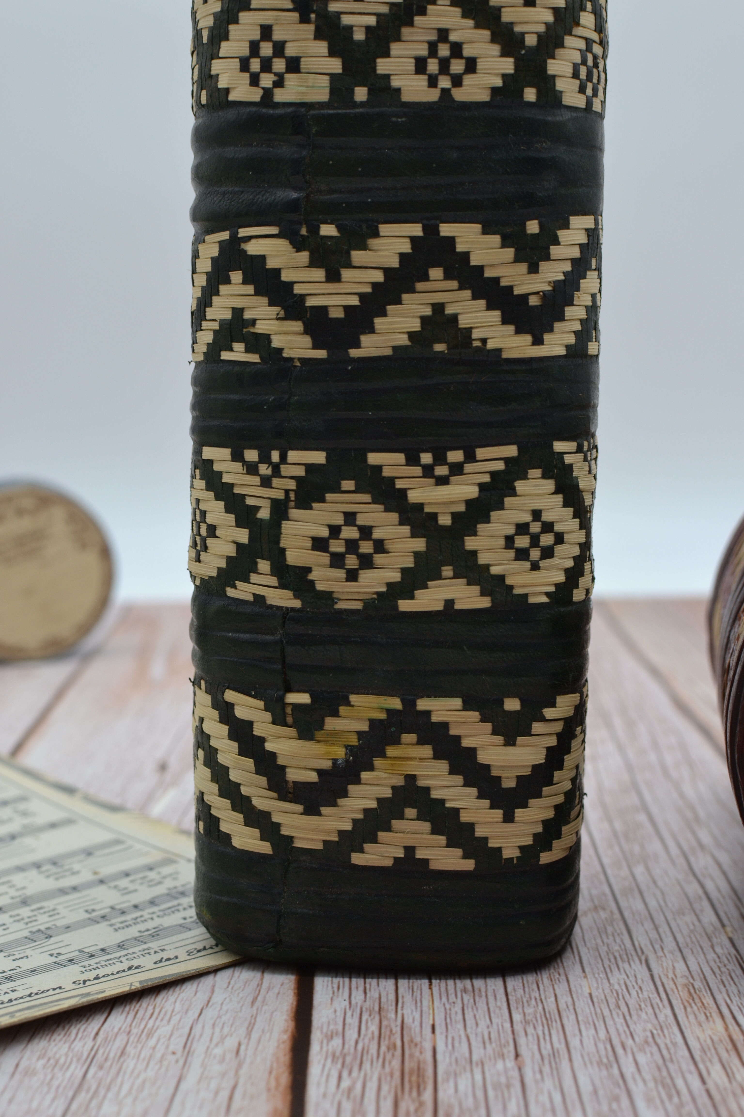 Set of 2 decorative vintage bottles covered with leather & wicker