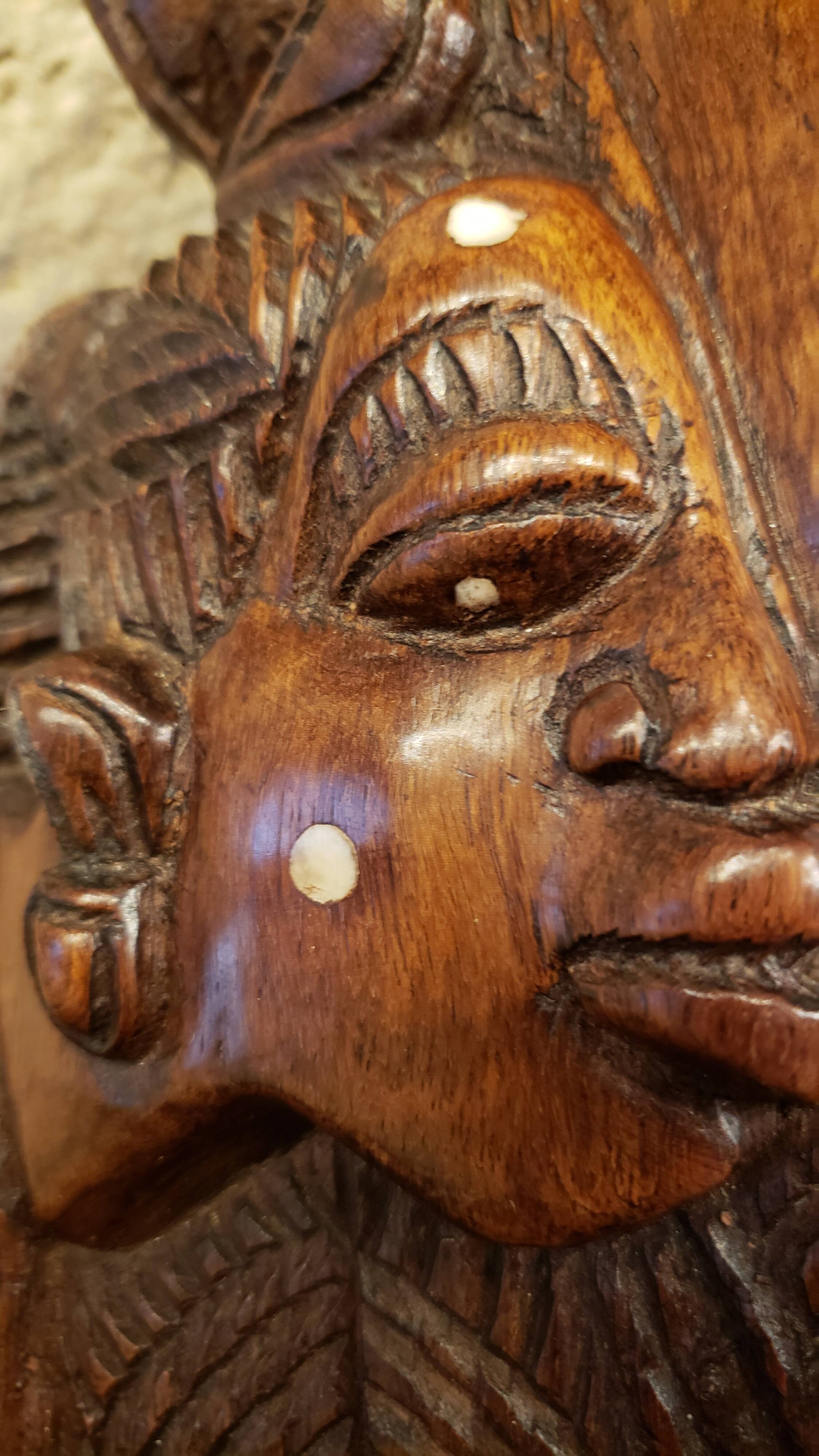 Old large African wall mask in carved wood