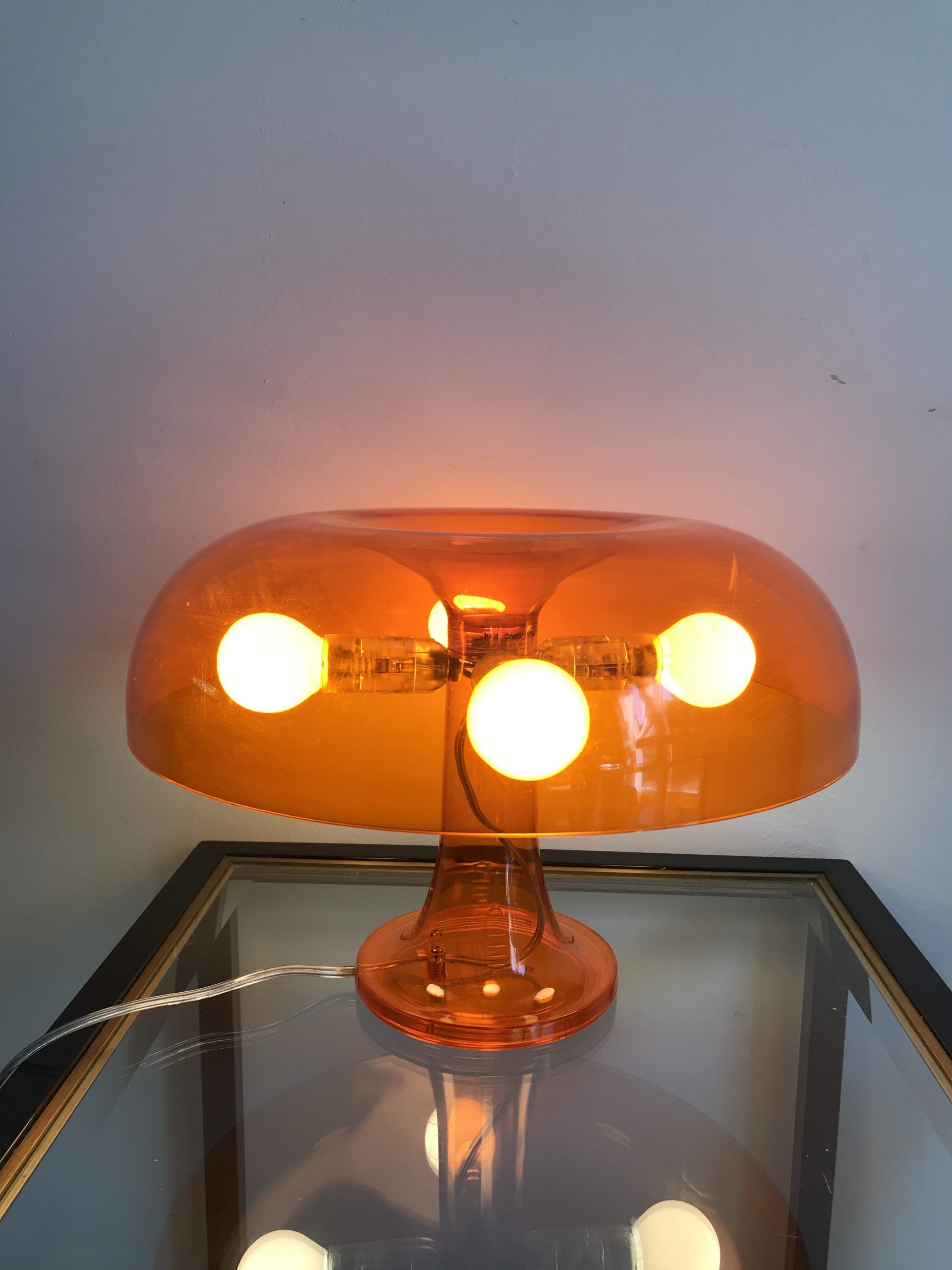 Orange nessino pose lamp for artemide by giancarlo mattioli