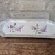 Limoges enamel porcelain cake dish LF with lilac flower decoration.