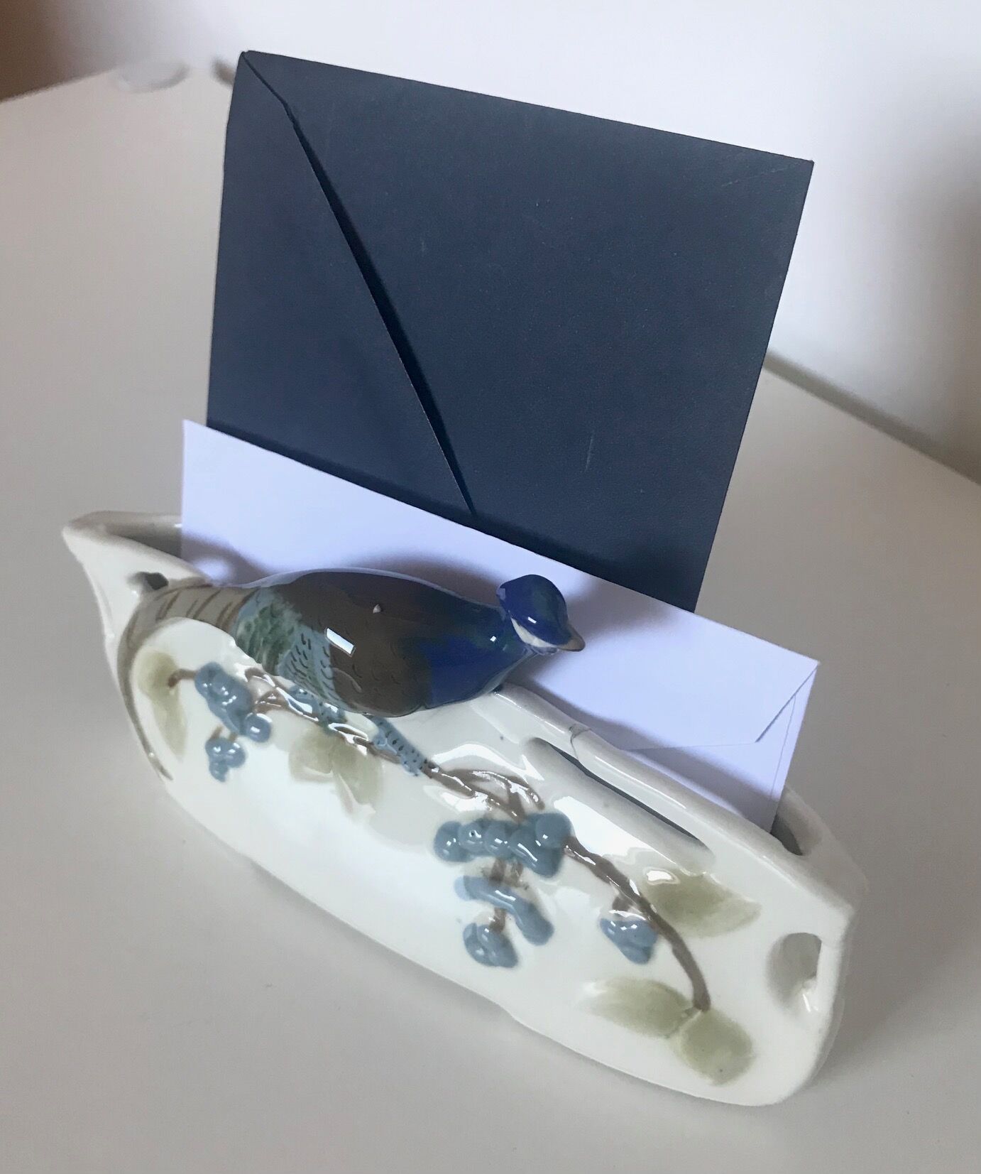 Letter door in earthenware topped with a peacock