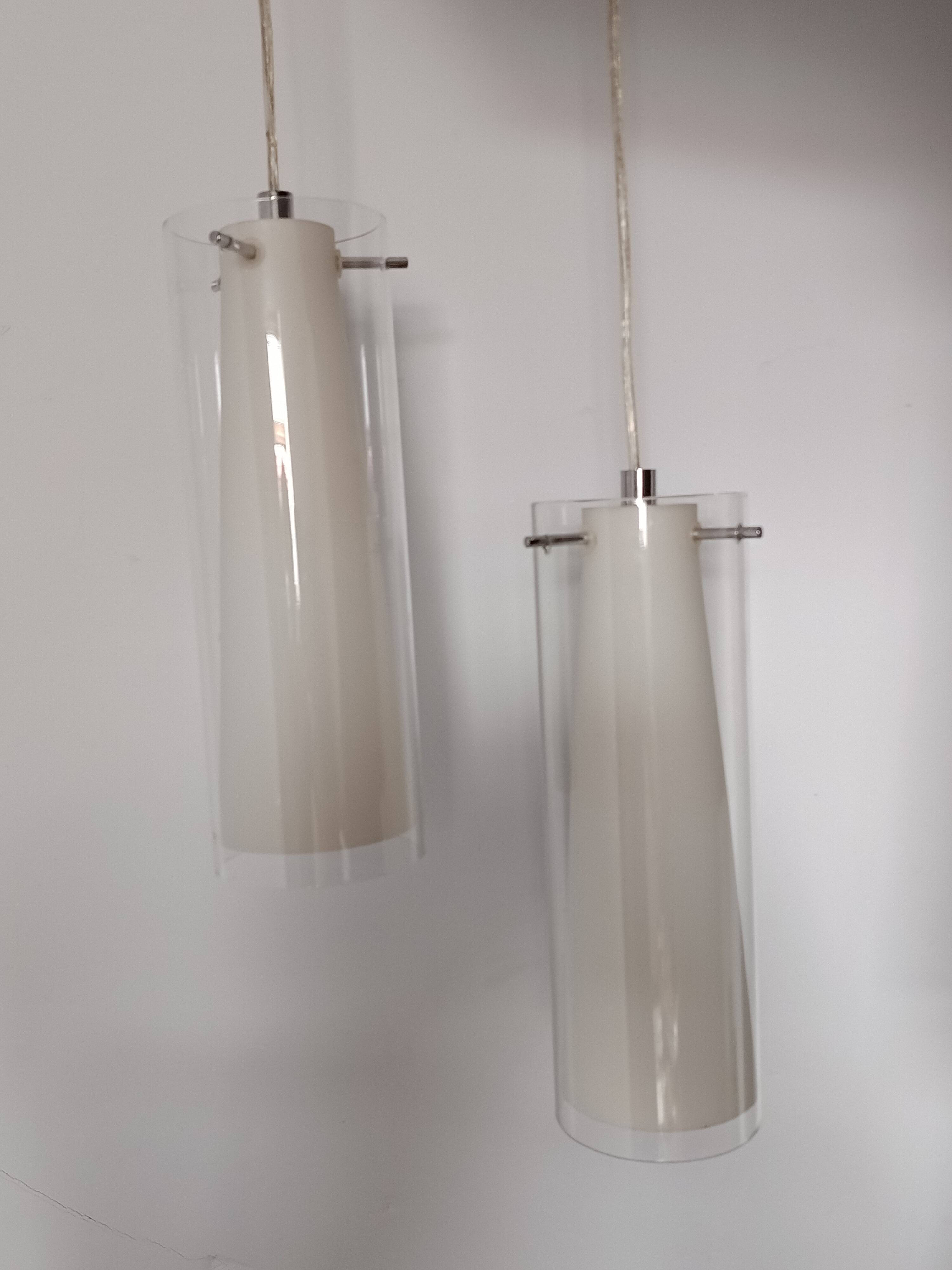 Transparent glass suspensions and white opaline glass inside.