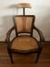 Old barber's / hairdresser's chair with caning