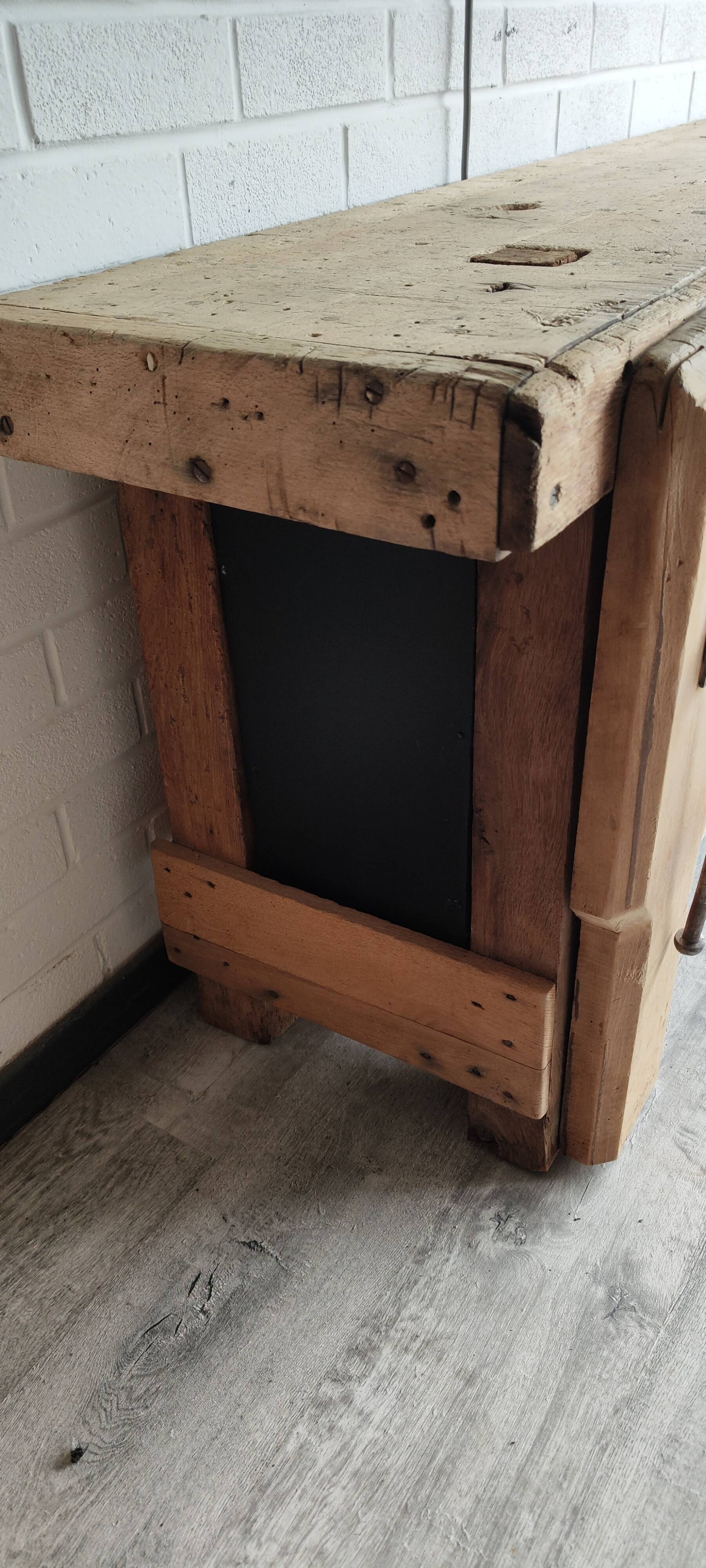 Old workbench furniture with six drawers and a door